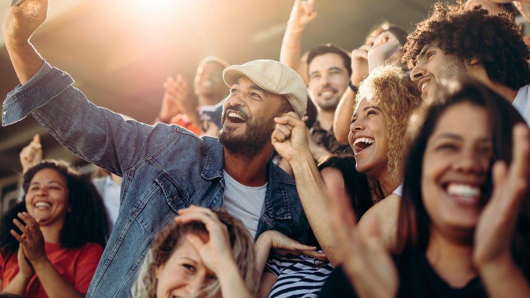 soon you - Soon, You Can Cut Through Stadium Cellular Congestion With Turbo Live by AT&T 1 group of supporters taking selfie watching a football match jacob lund adobe stock